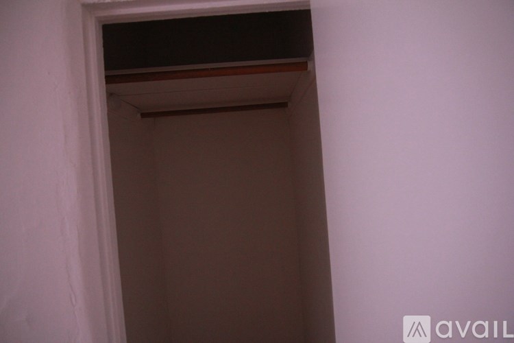 A small white doorway with a brown trim.