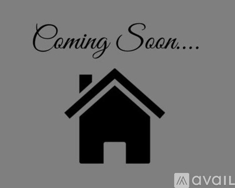 A graphic of a house with the text "Coming Soon..." above it.
