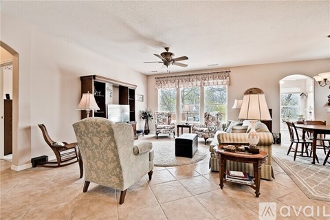 A living room with a chair and a table.