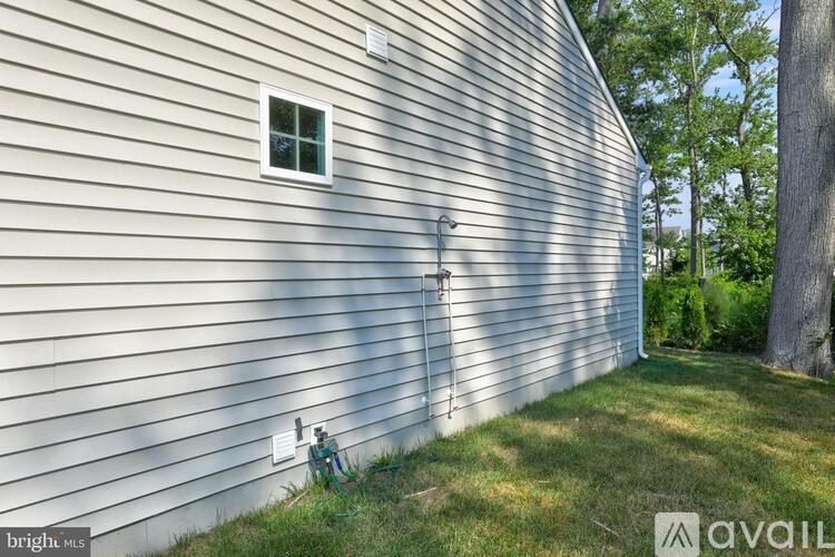 A house with a window and a small antenna on the side.
