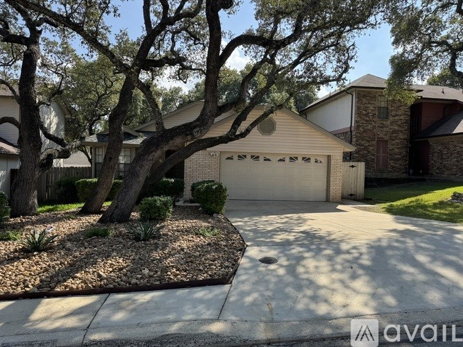 A house with a tree in front of it.