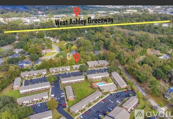 An aerial view of a neighborhood with a label "West Ashley Greenway" and two red location markers.