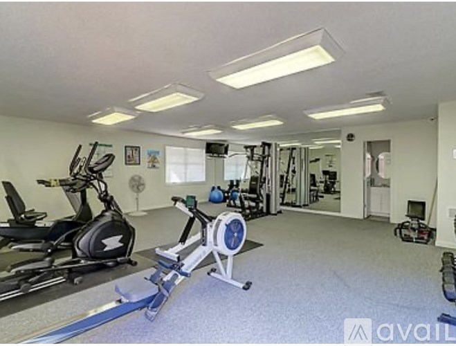 A well-equipped gym with a variety of exercise machines.