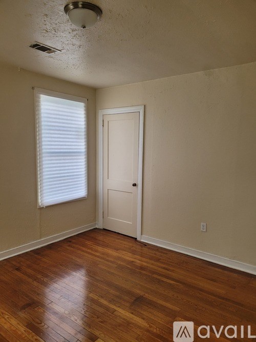 A room with a door and a window.
