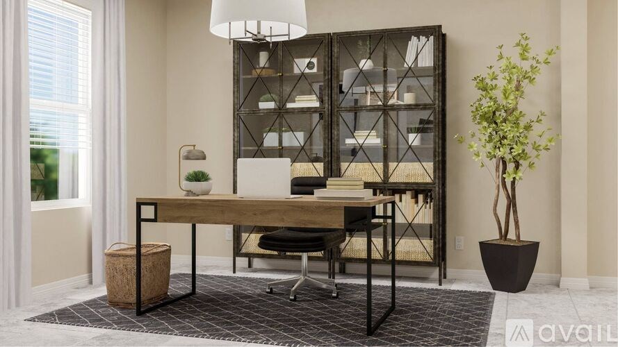 A modern home office with a wooden desk, black chair, and a large window.