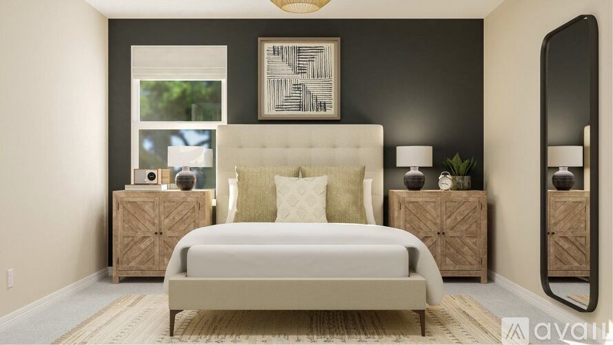 A bedroom with a large bed and two wooden cabinets.