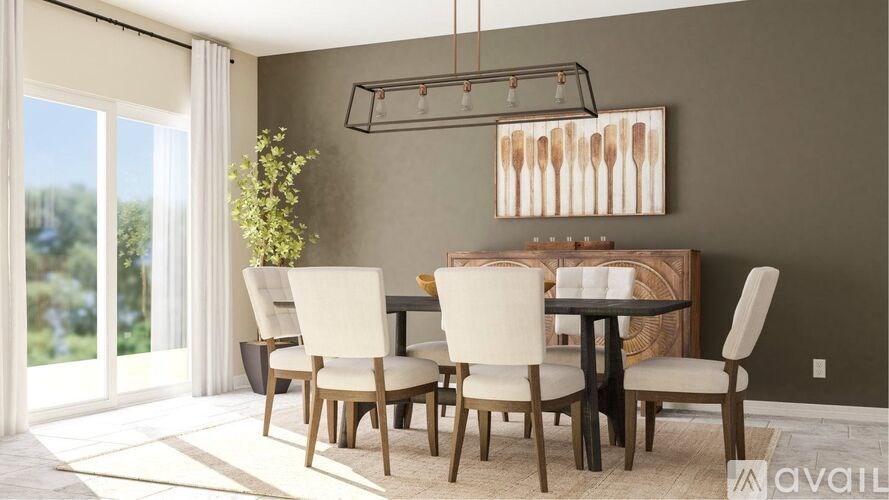 A modern dining room with a glass table and chairs.