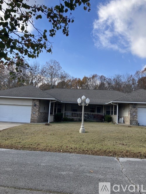 A house with a driveway in front of it.