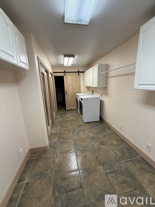 A kitchen area with a dishwasher and cabinets.
