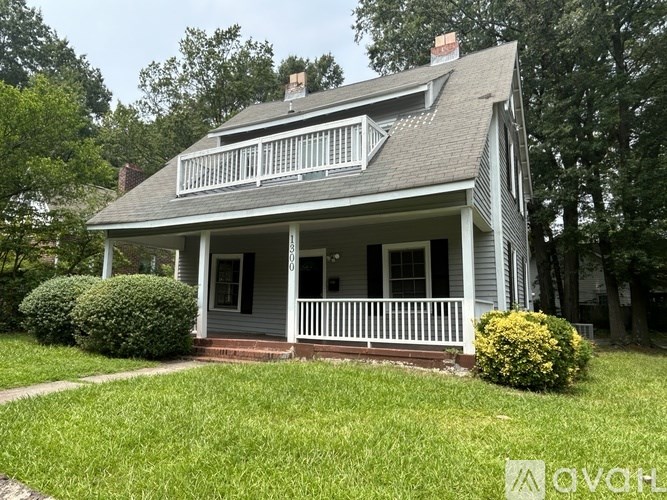 A house with a grey roof and white trim.