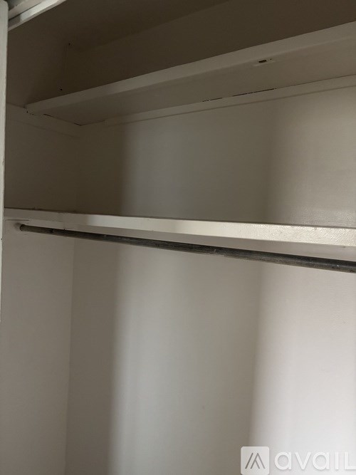 A room with wooden walls and a patterned carpet.