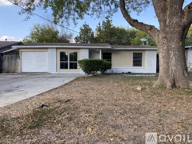 A house with a tree in front of it.