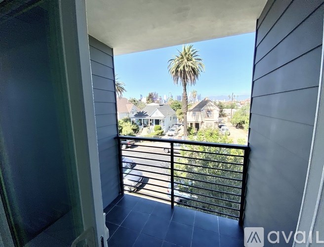 A balcony with a view of a residential area.