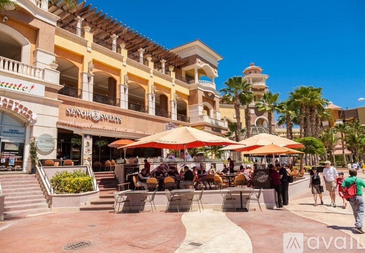 A sunny day at the Senor Swings restaurant with people enjoying their time outside.