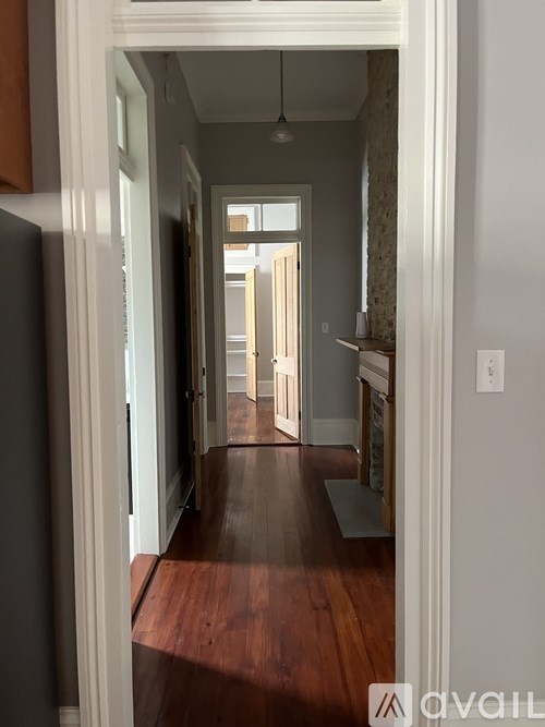 A long hallway with a light at the end.