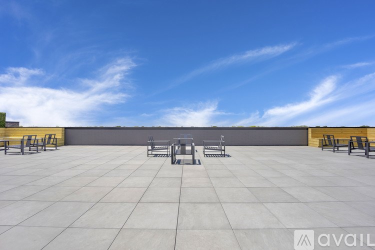 A large open patio with a table and chairs.