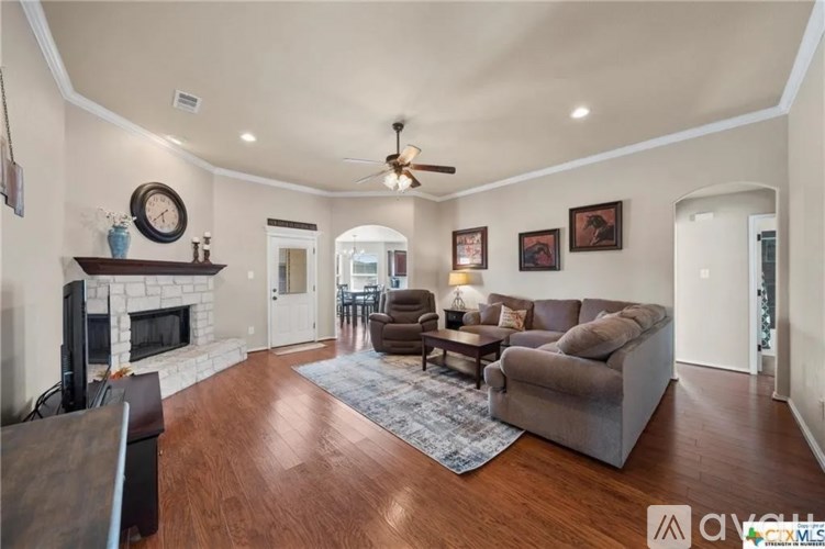 A living room with a fireplace and a couch.