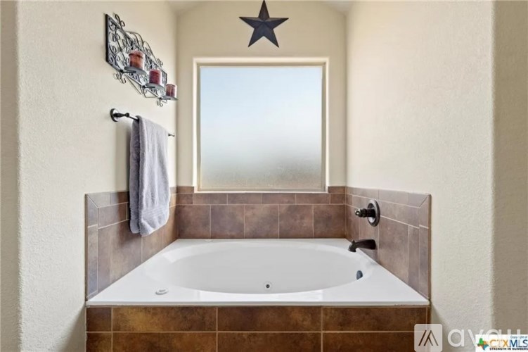 A bathroom with a star decoration on the wall.