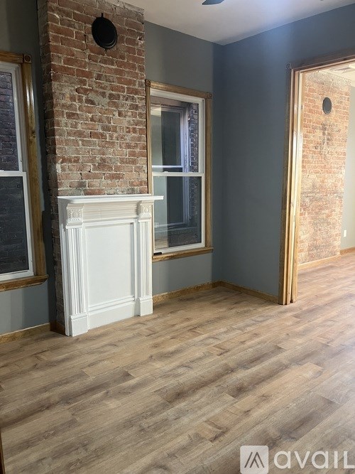A staircase with a metal railing and patterned carpeted steps.