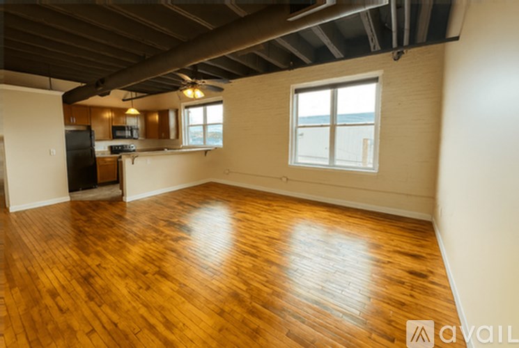 A room with wooden floors and a window.