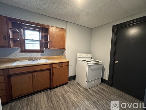 A small laundry room with a washer and dryer.