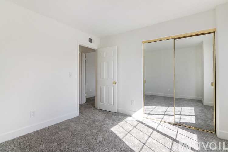 A room with a white door and a glass door.
