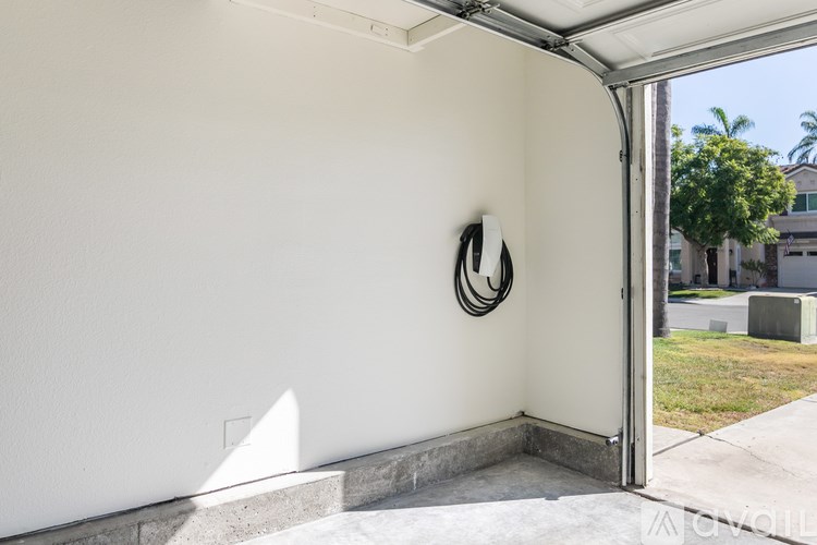 A white wall with a circular decoration on it.