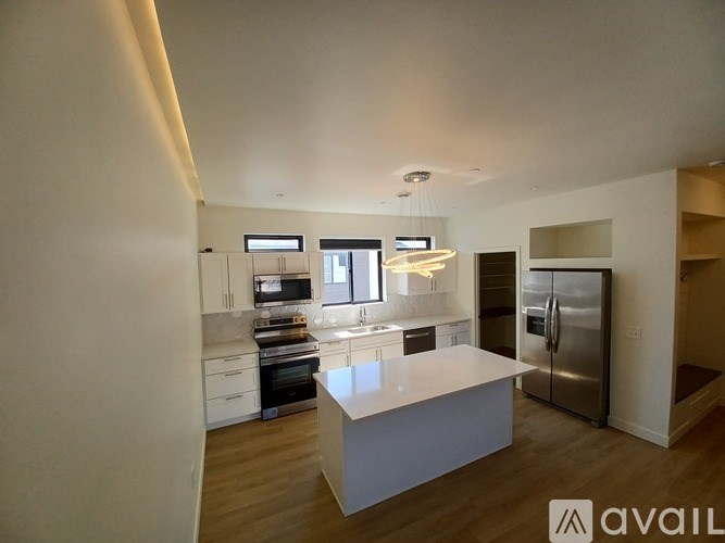 A modern kitchen with a large island in the middle.