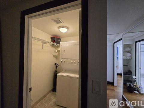 A small laundry room with a washer and dryer.