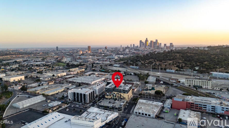 A red marker is placed on a building in a cityscape.