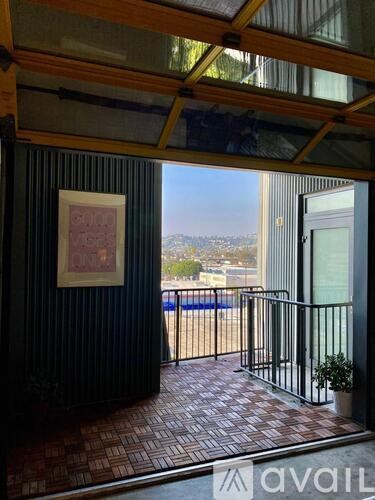 A balcony with a view of the city.