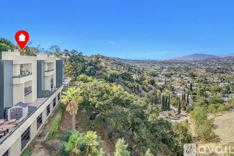 A red pin marks a location on a building in a scenic area.