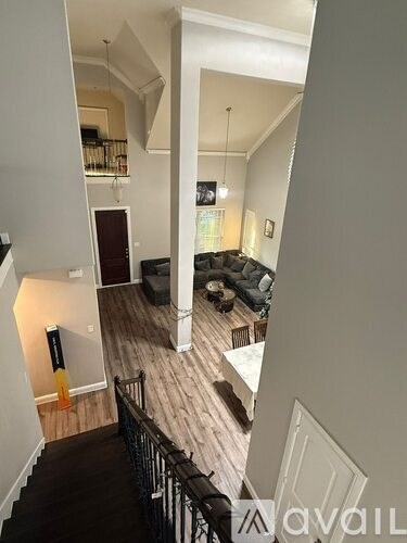A living room with a couch and a television.