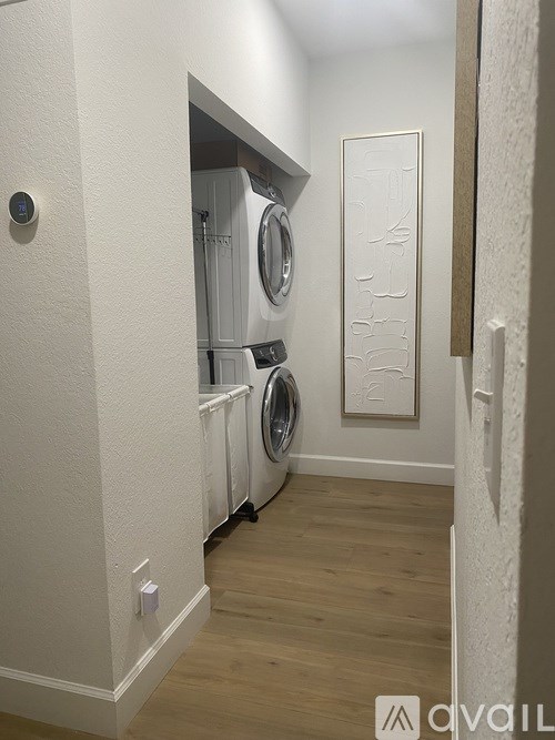 A laundry room with a washer and dryer.