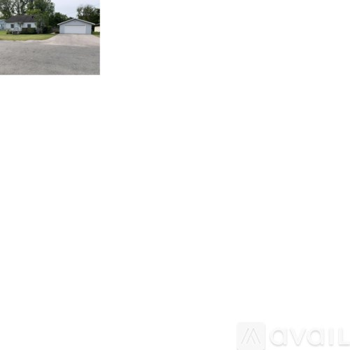 A house with a garage and a driveway.