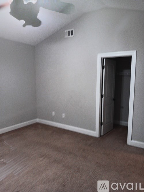 A room with a door and a window.