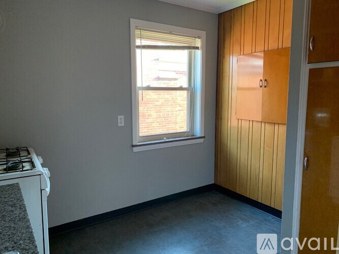 A room with a window and a door.