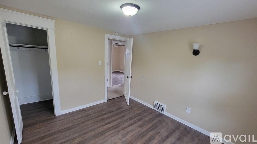 A room with a door and a window.