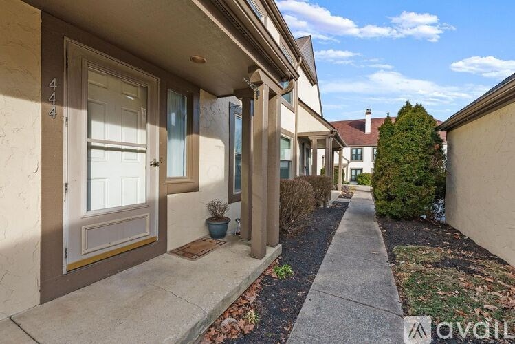 A sunny day at a quiet residential street with house number 442.