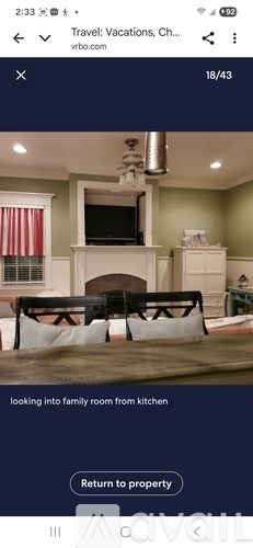 A family room with a fireplace and a television.