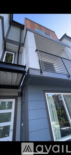 A modern house with a balcony and a window.