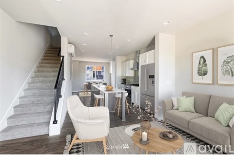 A living room with a couch, chair, and coffee table.