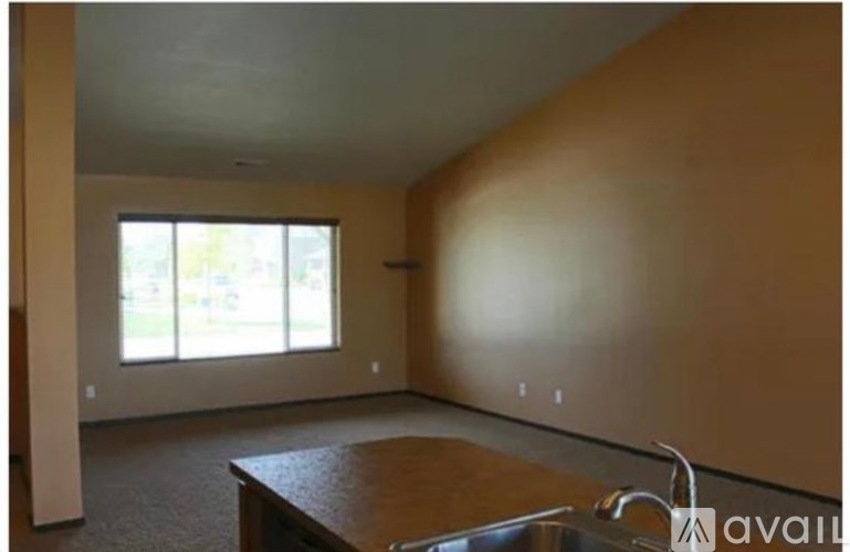 A room with a table and a window.