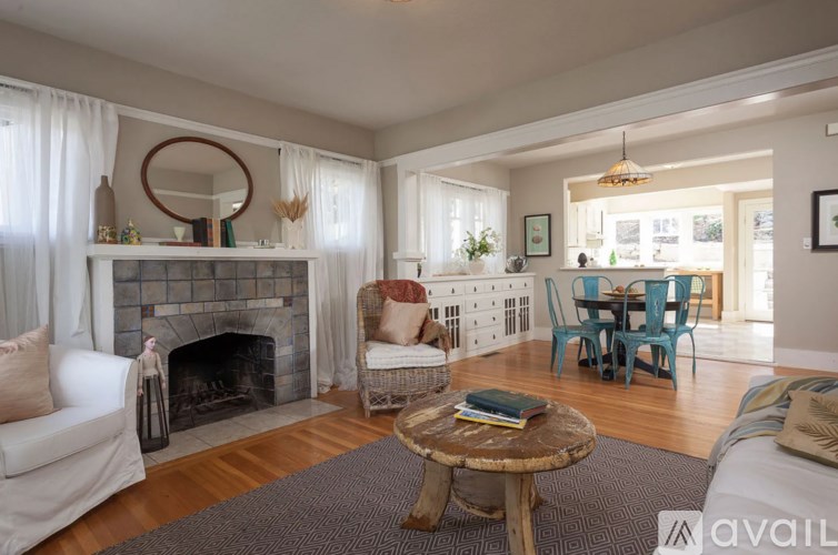 A living room with a fireplace and a couch.
