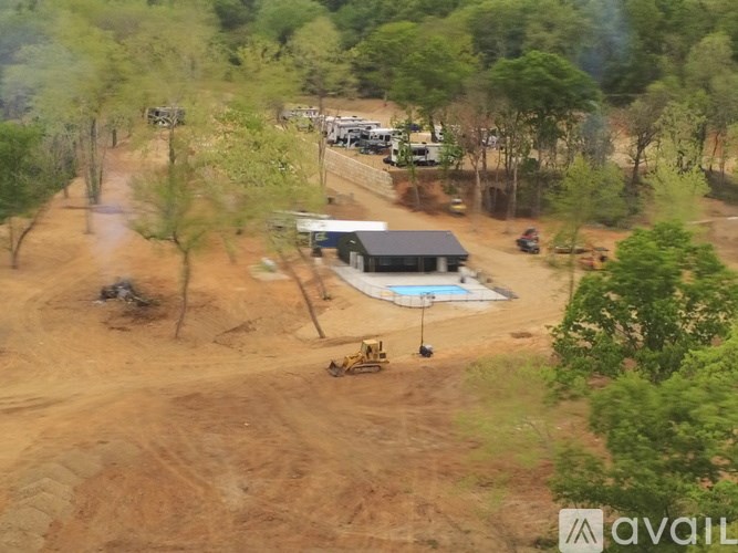 A construction site with a swimming pool and a building.