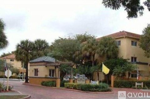 A building with a yellow flag in front of it.