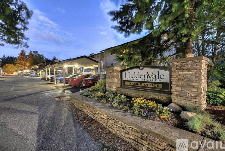 A sign for Hidden Valley Learning Office is displayed in front of a building.