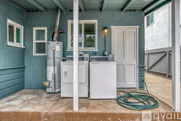 A room with a washer and dryer in it.