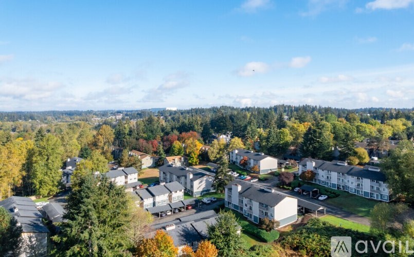 A bird's eye view of a residential area with houses and trees.