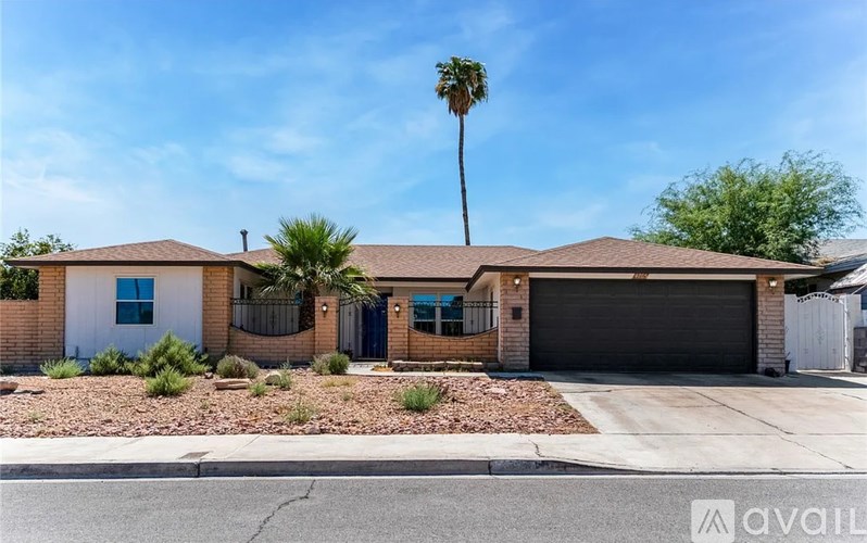A house with a brown roof and a white door is for sale.